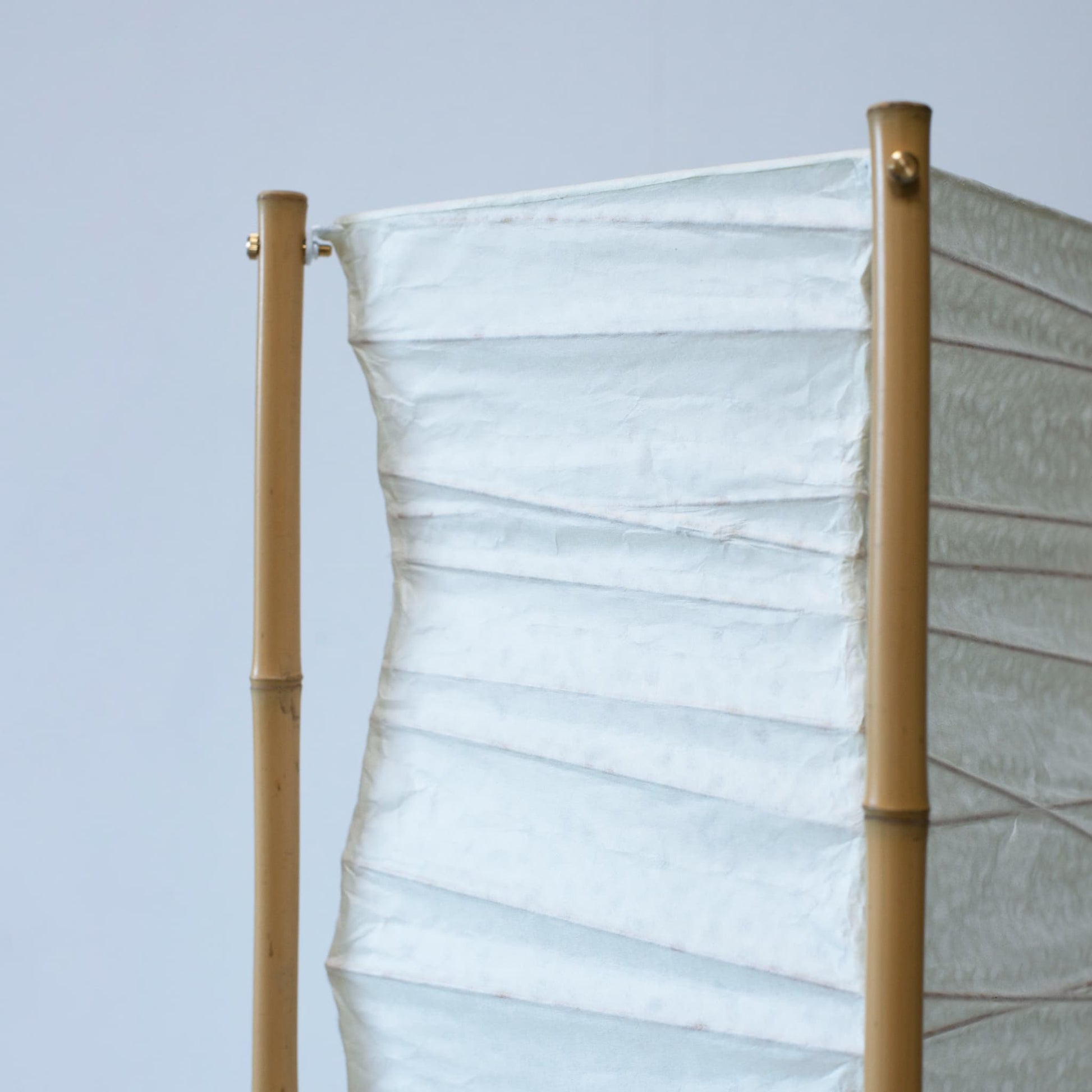 A Japanese paper floor lamp on white background. 
