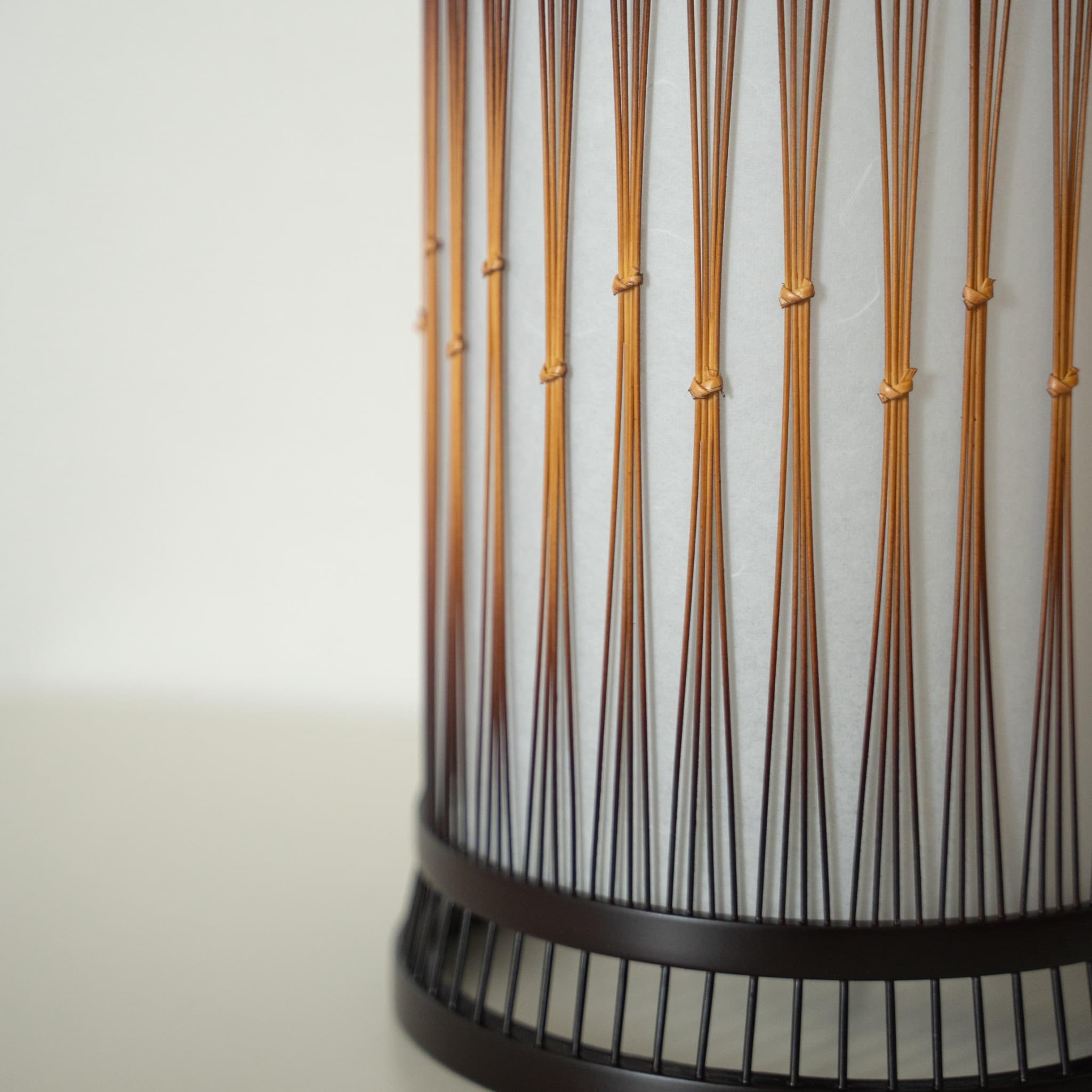 A beautiful bamboo floor lamp crafted with finely processed, delicate bamboo bound together with rattan."