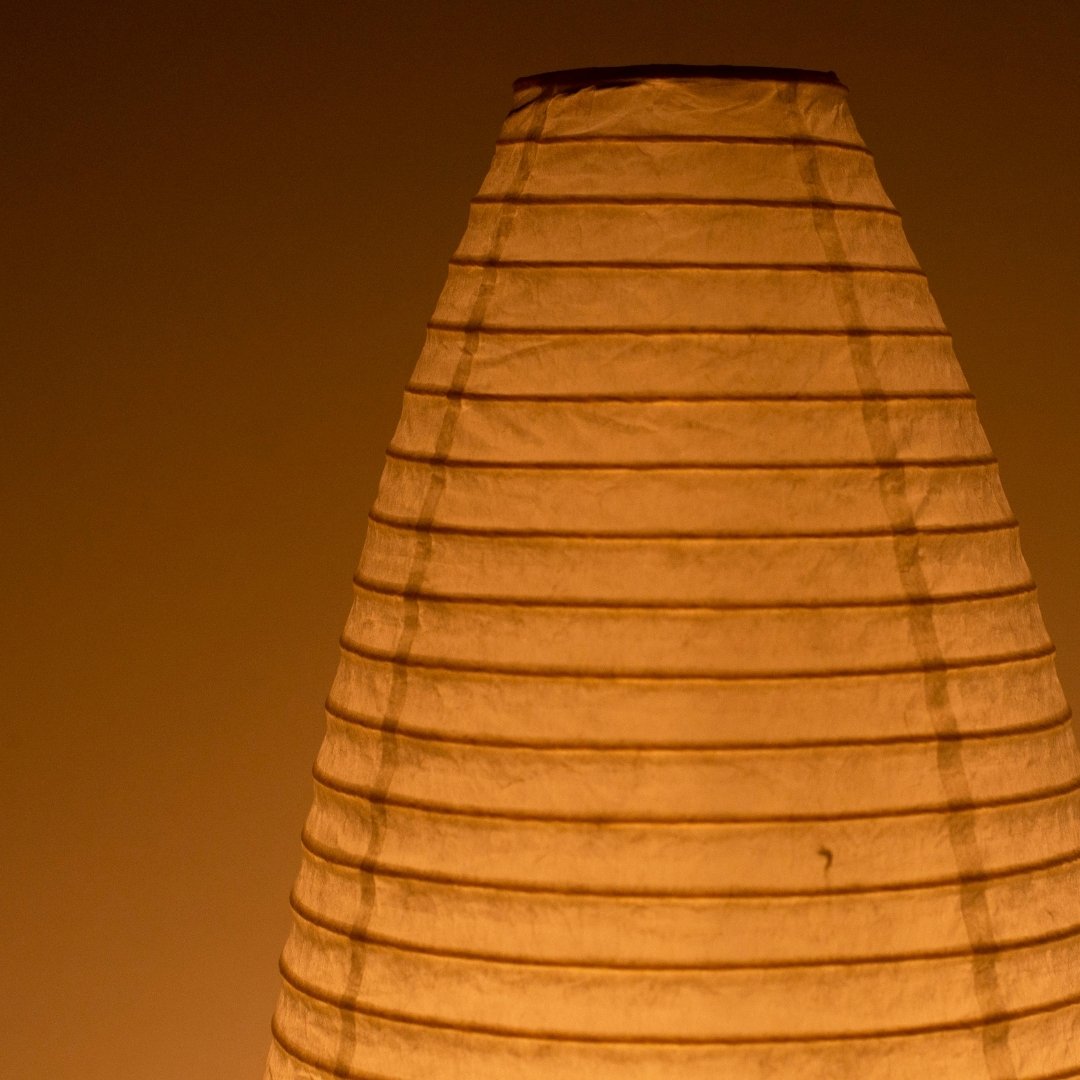 Close-up glowing Japanese floor lamp "paper moon 13" – traditional Mino Washi paper floor lamp design