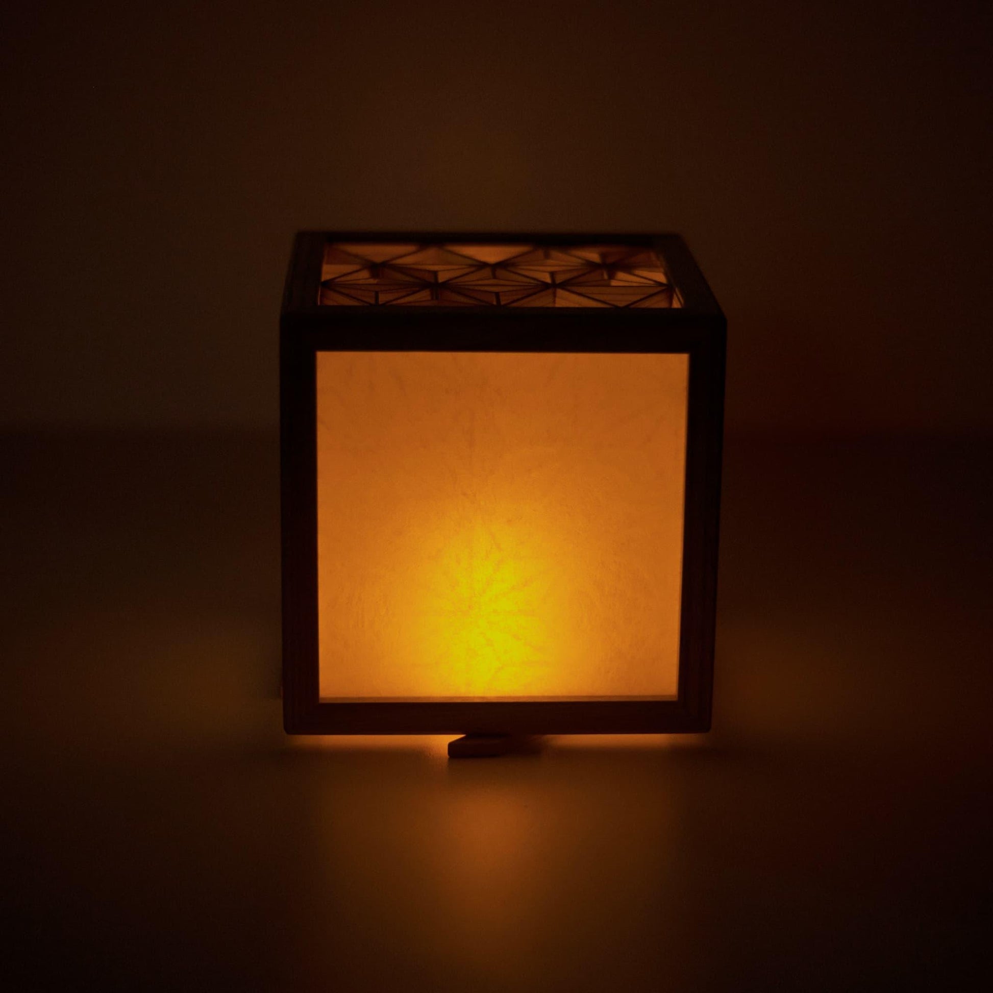 A front view of a medium-sized kumiko lighting cover, showcasing the elegant design and warm glow.