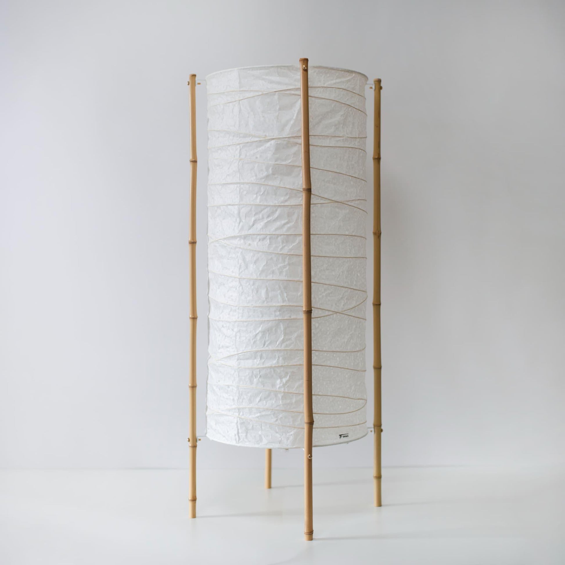 Tall floor lamp with 4 bamboo supports, crafted with Gifu lantern techniques and Mino washi paper.