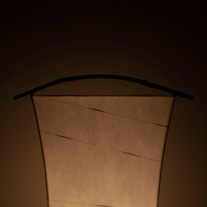 Detail of a unique paper floor lamp crafted with Gifu lantern techniques and 1300-year-old Mino washi paper, showing the intricate patterns and textures of the washi paper.