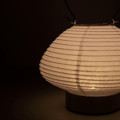 Portable table lamp resembling a traditional Japanese lantern, crafted with Gifu lantern techniques and Mino washi paper.