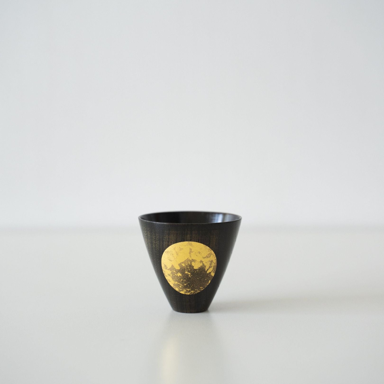 Japanese Gold Leaf Sake Cup Small on a white table