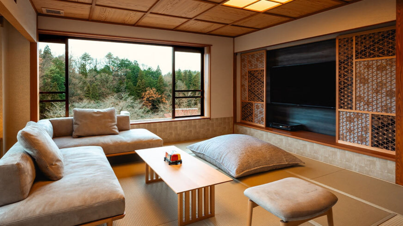 A sliding door decorated with intricate Kumiko-zaiku woodwork positioned next to a television in a luxury hotel suite.