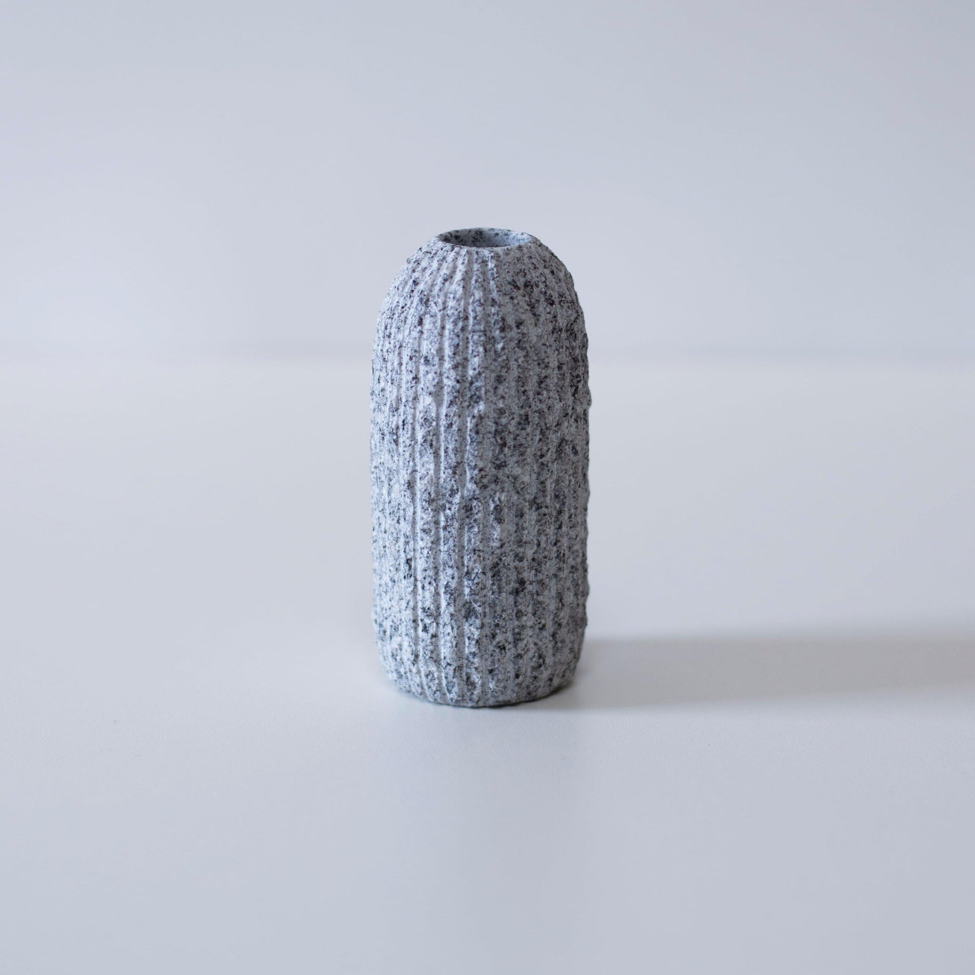 Small minimalist vase made from Aji stone, a type of granite found only in a specific region of Kagawa Prefecture, Japan.