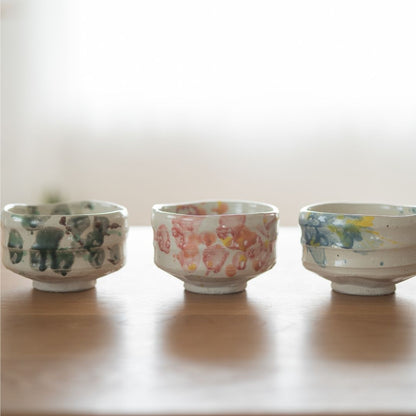Trio of Shino ware matcha chawan bowls: Forest, Flower, and Splash, displaying the unique seasonal artistic glaze expressions of the Shinzan Kiln.