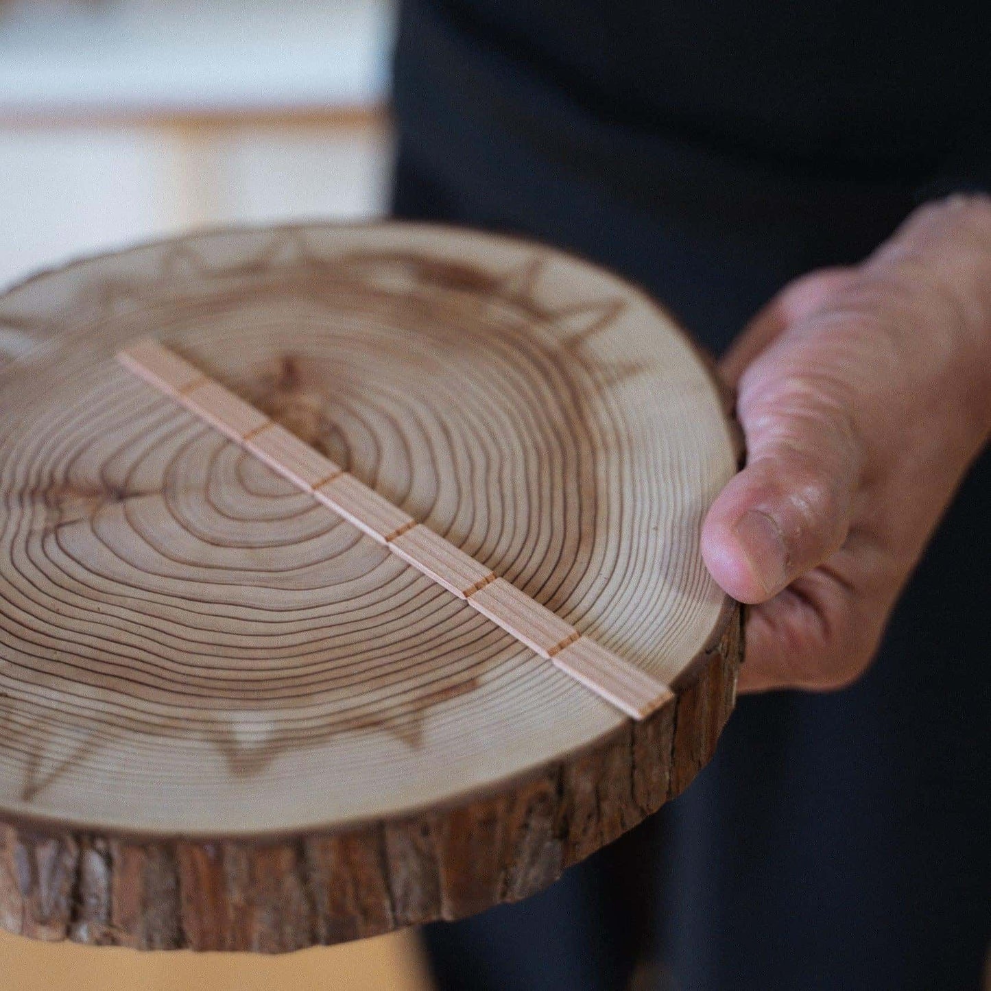 Pieces of Akita cedar, the material used for creating the delicate geometric patterns in kumiko craftsmanship, and individual kumiko components.