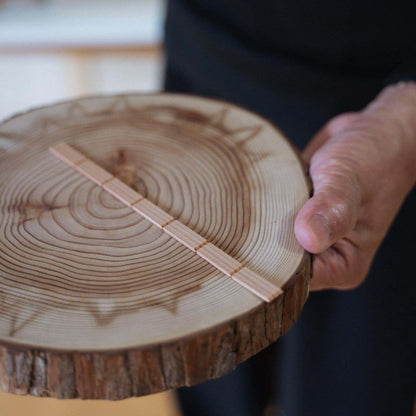 Pieces of Akita cedar, the material used for creating the delicate geometric patterns in kumiko craftsmanship, and individual kumiko components.