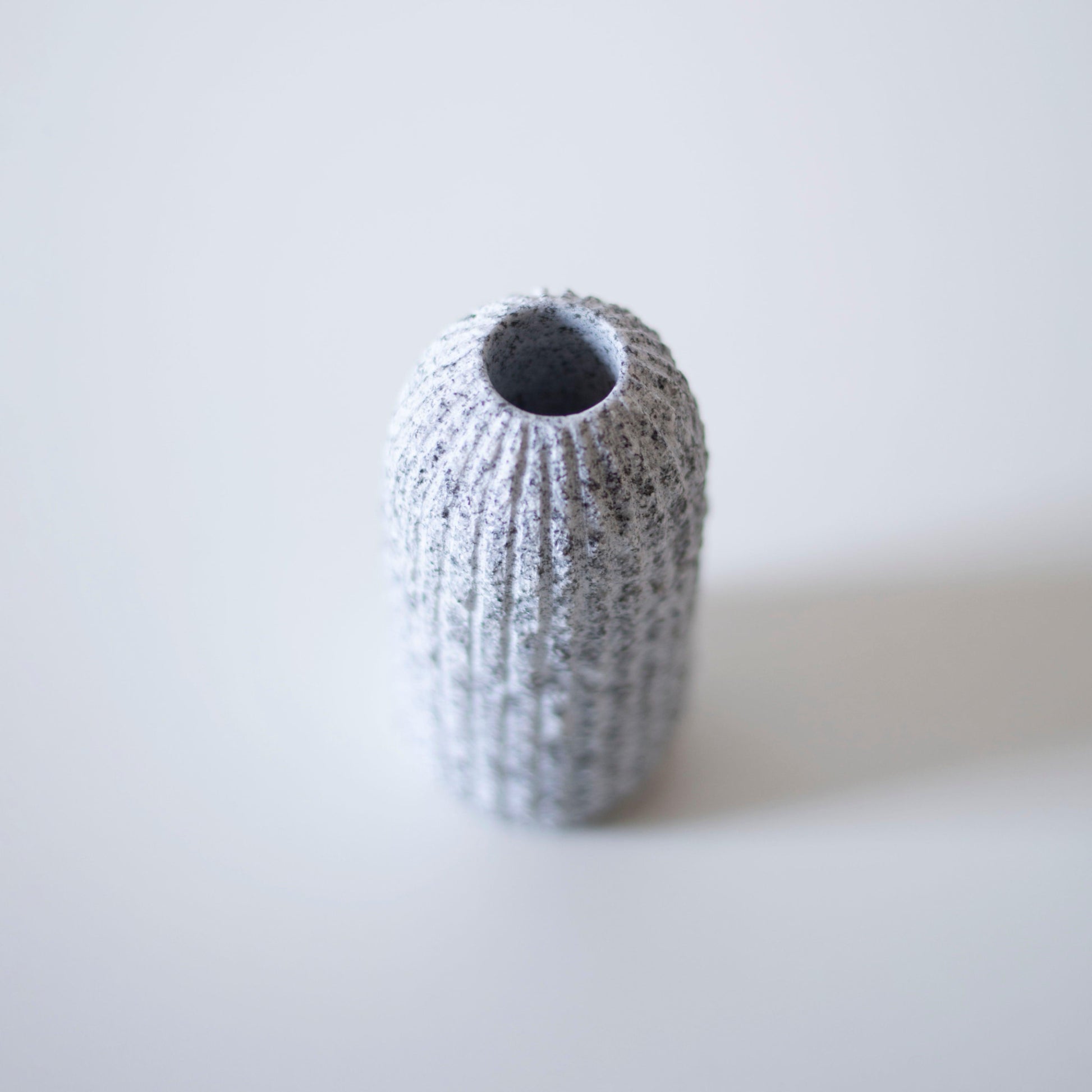An close-up of the top of a Japanese Aji stone flower vase