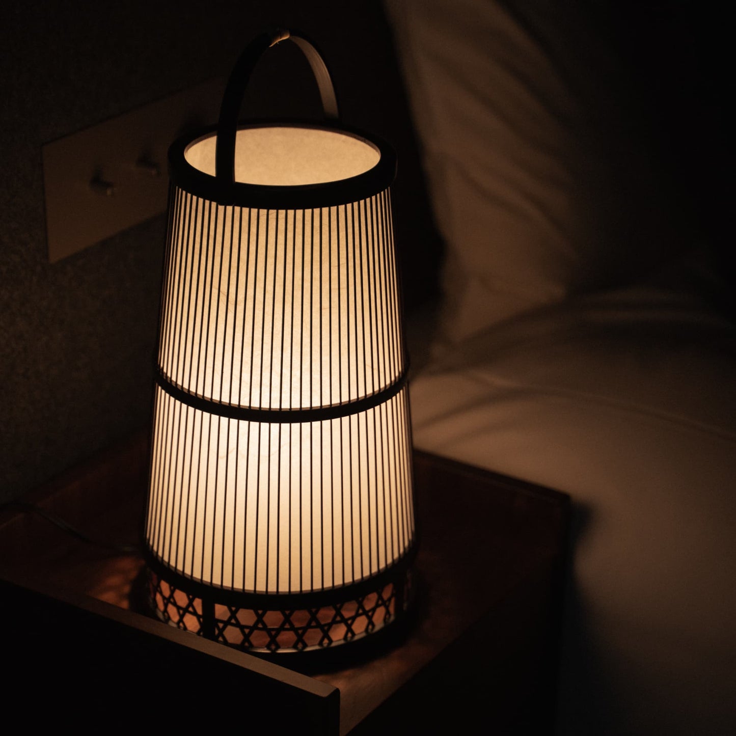 Japanese Bamboo Floor Lamp "Hagoromo" in a minimalist Japandi-style Bedroom. 