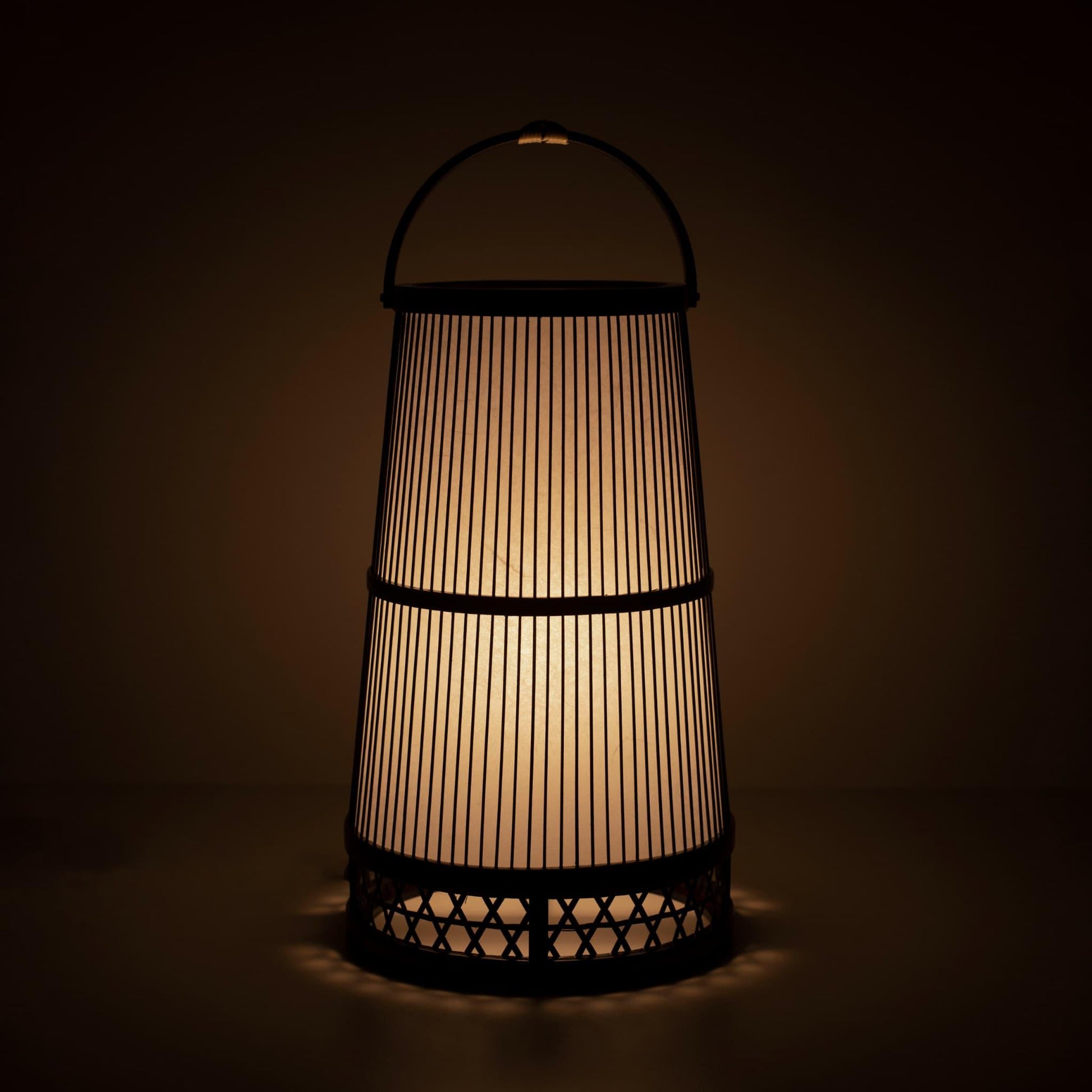 Japanese lamp crafted with 800-year-old Shizuoka bamboo artistry. Delicate bamboo strips create intricate patterns, casting a warm glow through Japanese paper.
