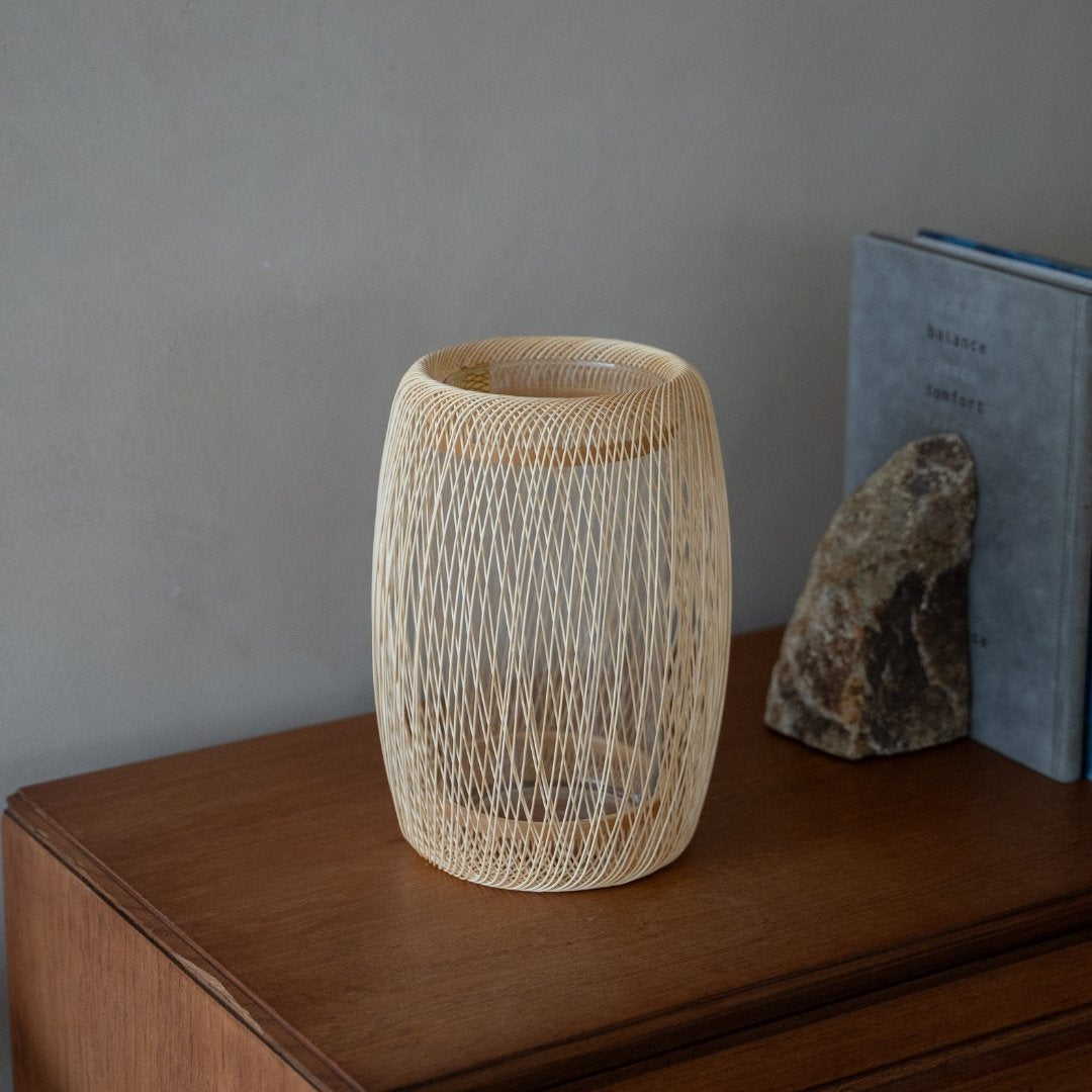 Japanese Bamboo Flower Vase "Cocoon" on a wood shelf - Authentic Ikebana flower vase with wabi-sabi aesthetics