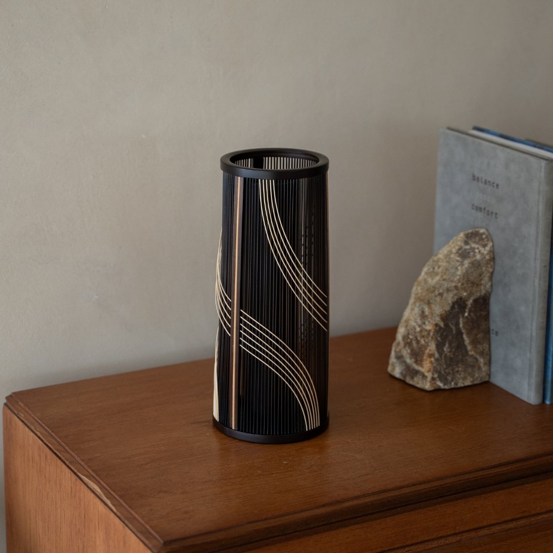 Japanese Bamboo Flower Vase “Flowing Water”on a wood shelf - Authentic ikebana flower vase with wabi-sabi aesthetics