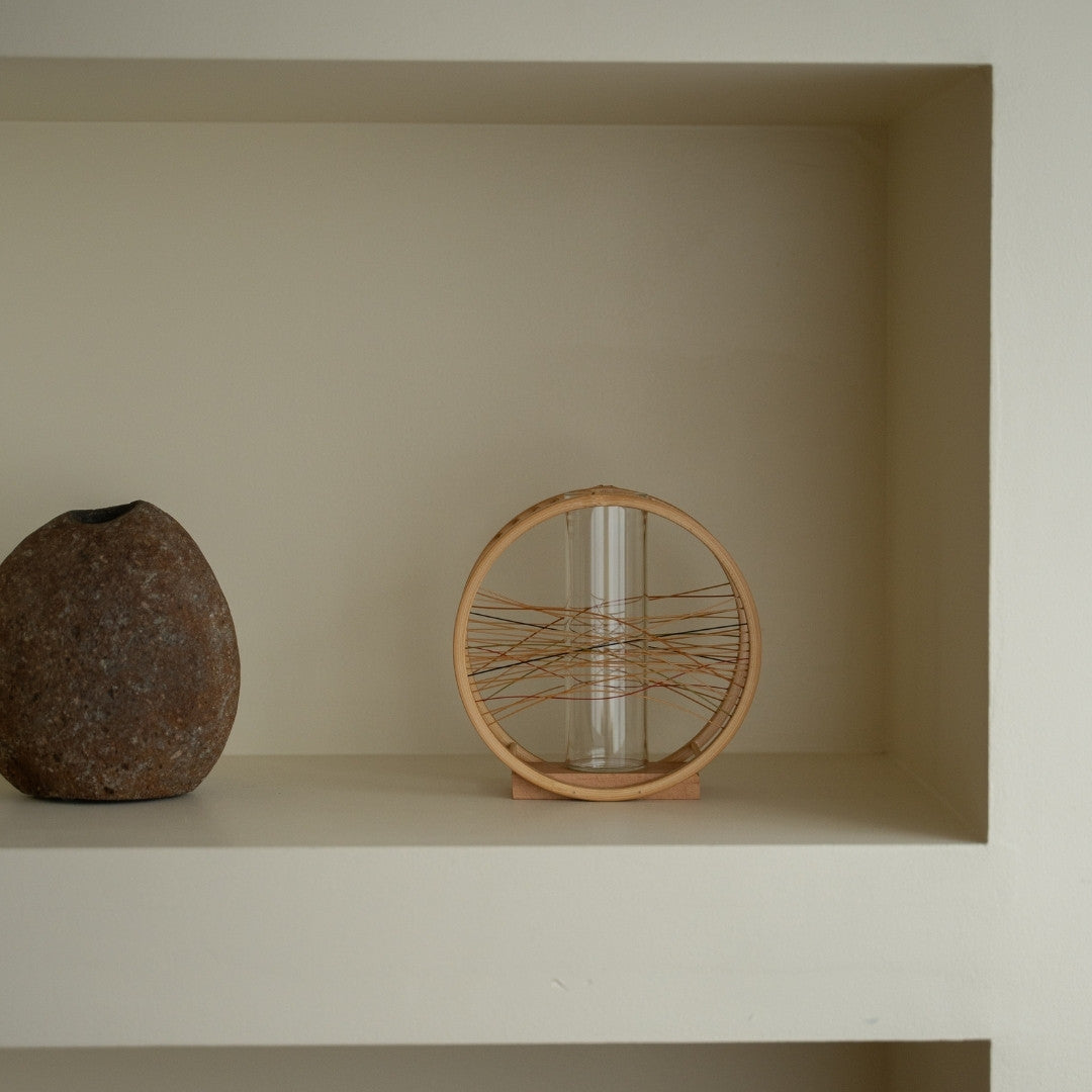 Japanese Bamboo Flower Vase “Flowing Wind” on a white shelf - Japandi style ikebana flower vase with wabi-sabi aesthetic