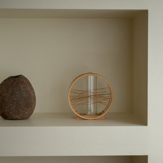 Japanese Bamboo Flower Vase “Flowing Wind” on a white shelf - Japandi style ikebana flower vase with wabi-sabi aesthetic