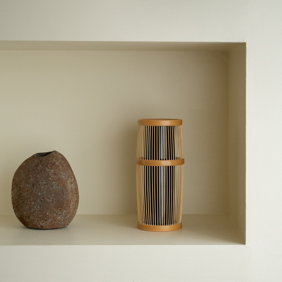 Japanese Bamboo Flower Vase “Shiori” on a white shelf - Japandi style ikebana flower vase with wabi-sabi aesthetics