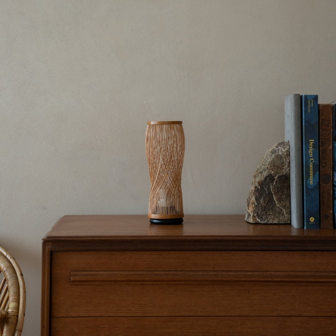 Japanese Bamboo Table Lamp “Single Bloom” on a wood shelf in Japandi room - Unique table lamps for bedroom & living room