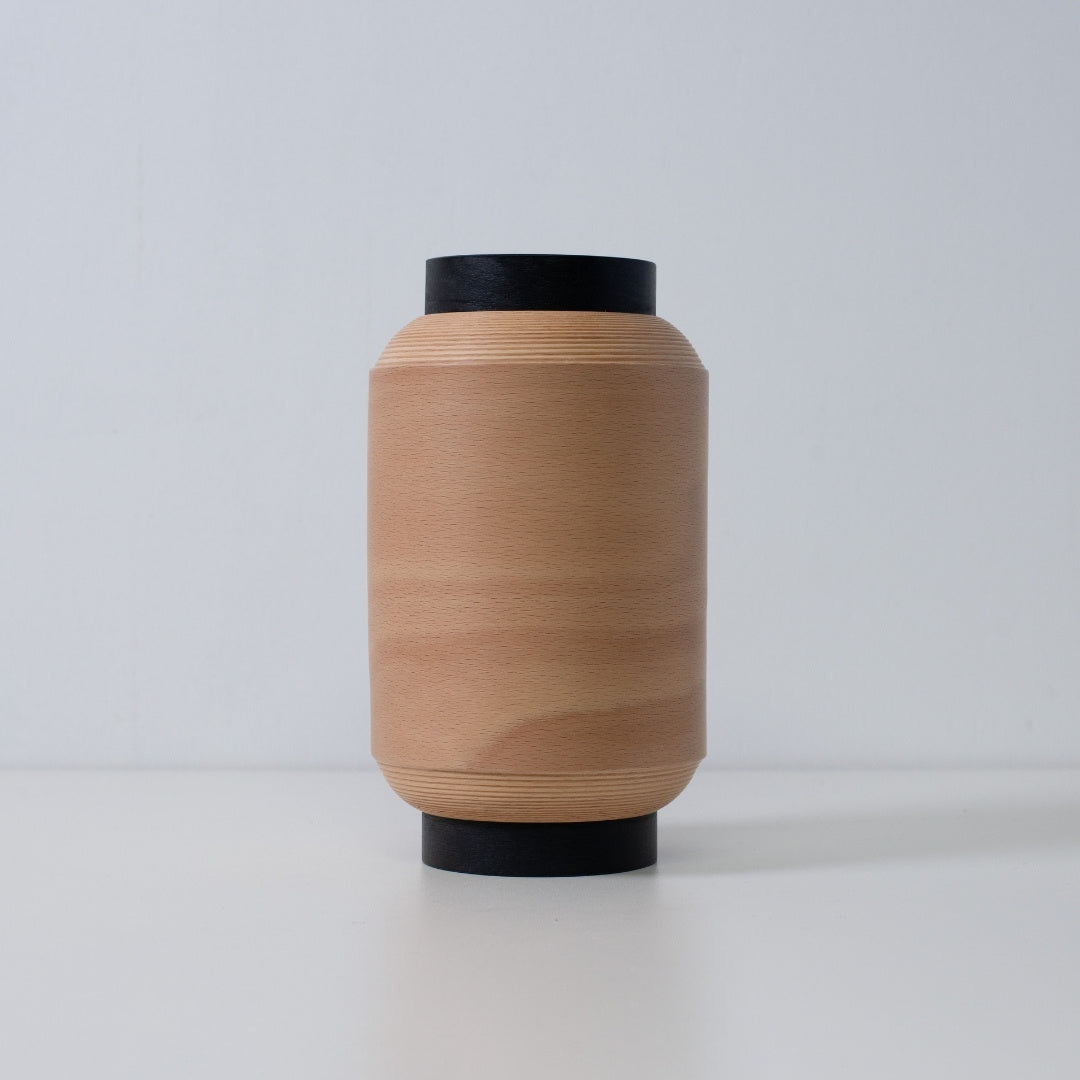 Minimalist Japanese table lamp made with coiled beech wood, perfect for living room ambience.