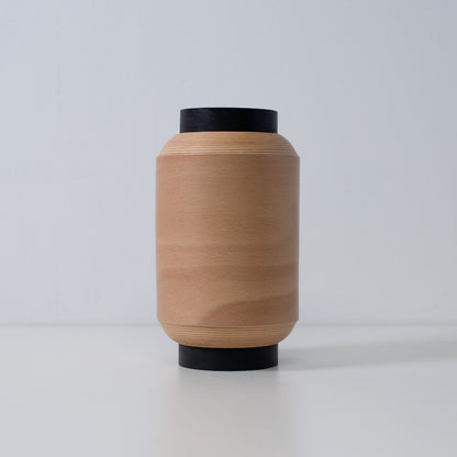 Minimalist Japanese table lamp made with coiled beech wood, perfect for living room ambience.