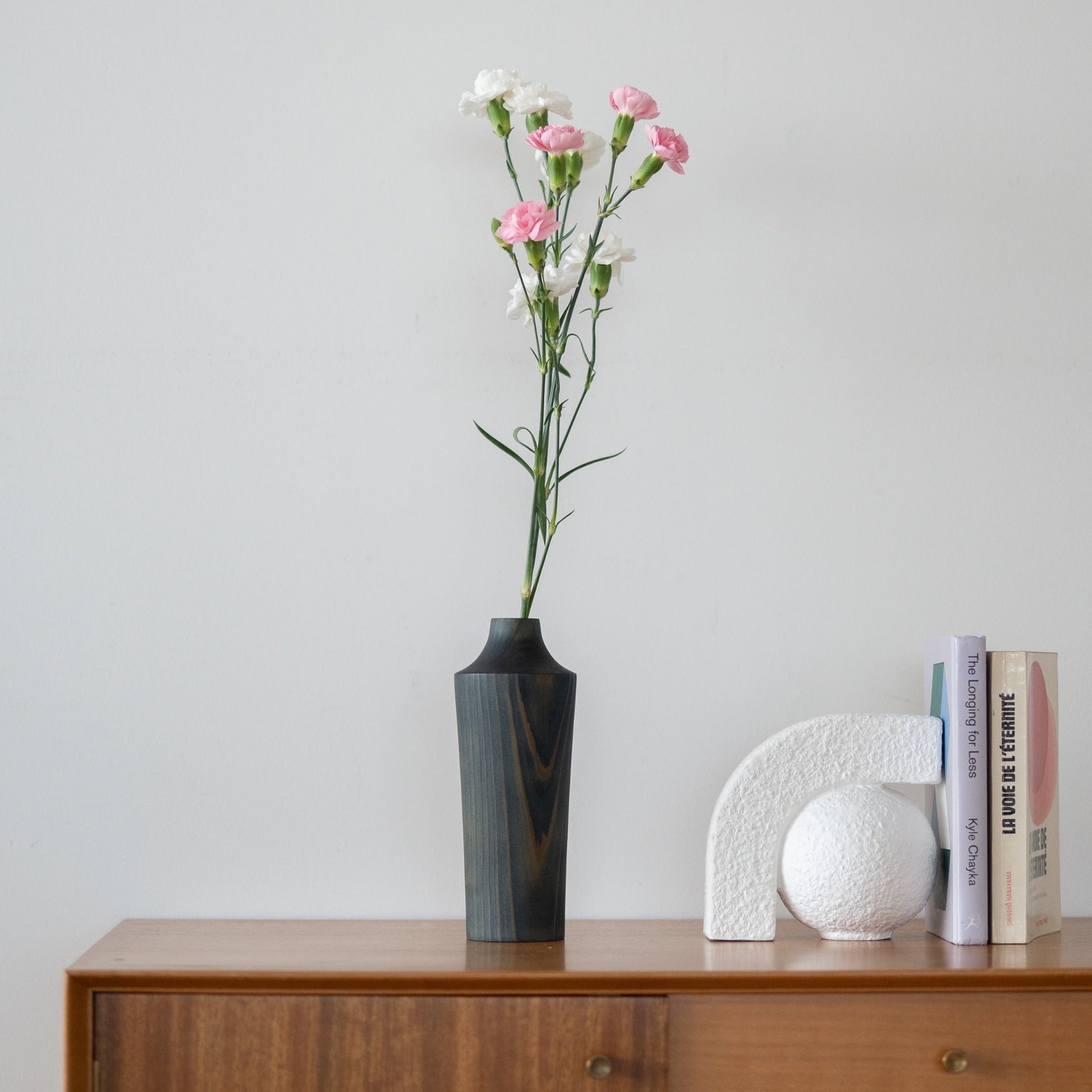 Japanese Cedar Ikebana Vase Indigo 02 on a wood console table in Japandi living room