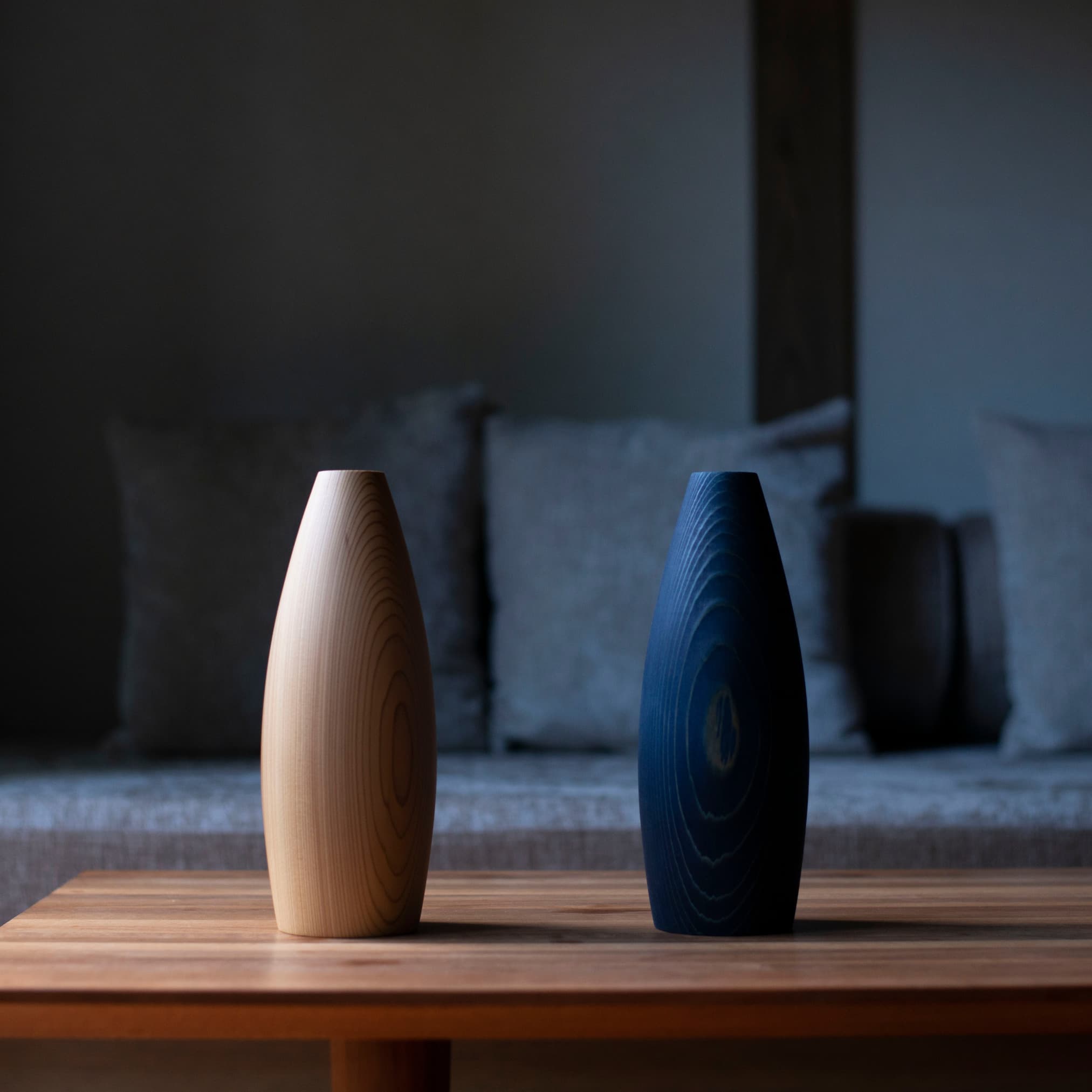 Japanese cedar wood vases on a table in Japandi living room. 