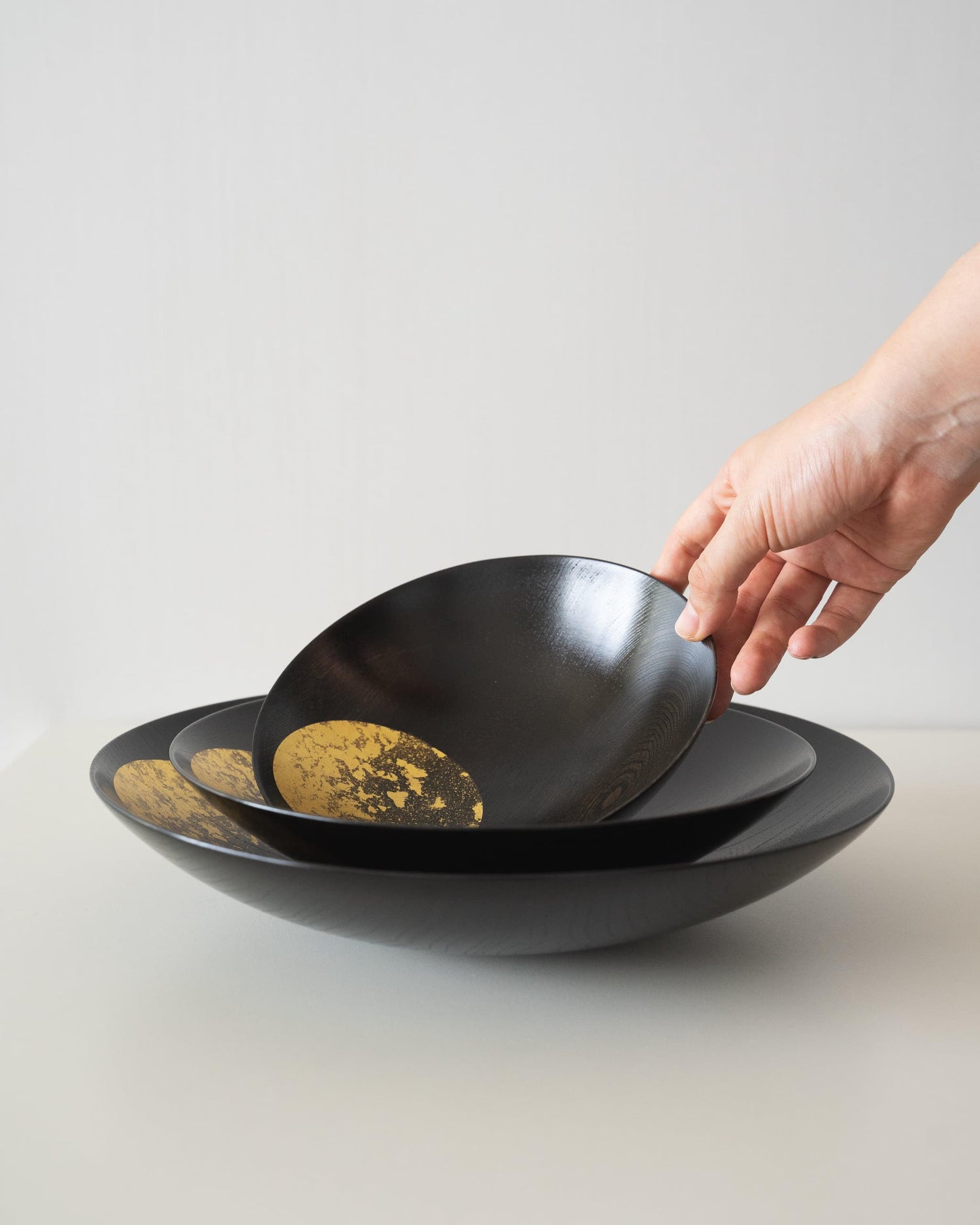 Japanese gold leaf bowls on a white table