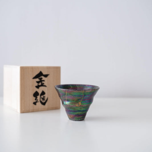 Gift set of an iridescent coral-shaped cup repaired with Kintsugi, a traditional Japanese technique, and a paulownia wood box.