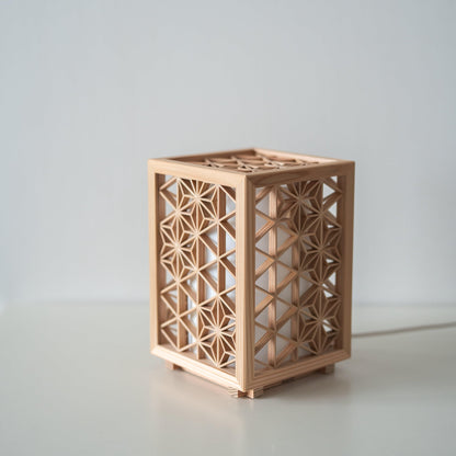 Japanese Kumiko Table Lamp "Asanoha" on a white table