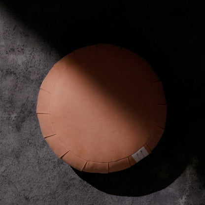 Smoky Rose ZAF MASTER meditation cushion zafu pillow in a dark room