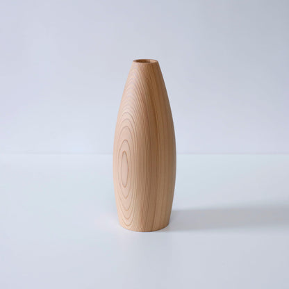 A minimalist cedar wood vase showcasing the natural beauty of the wood grain.