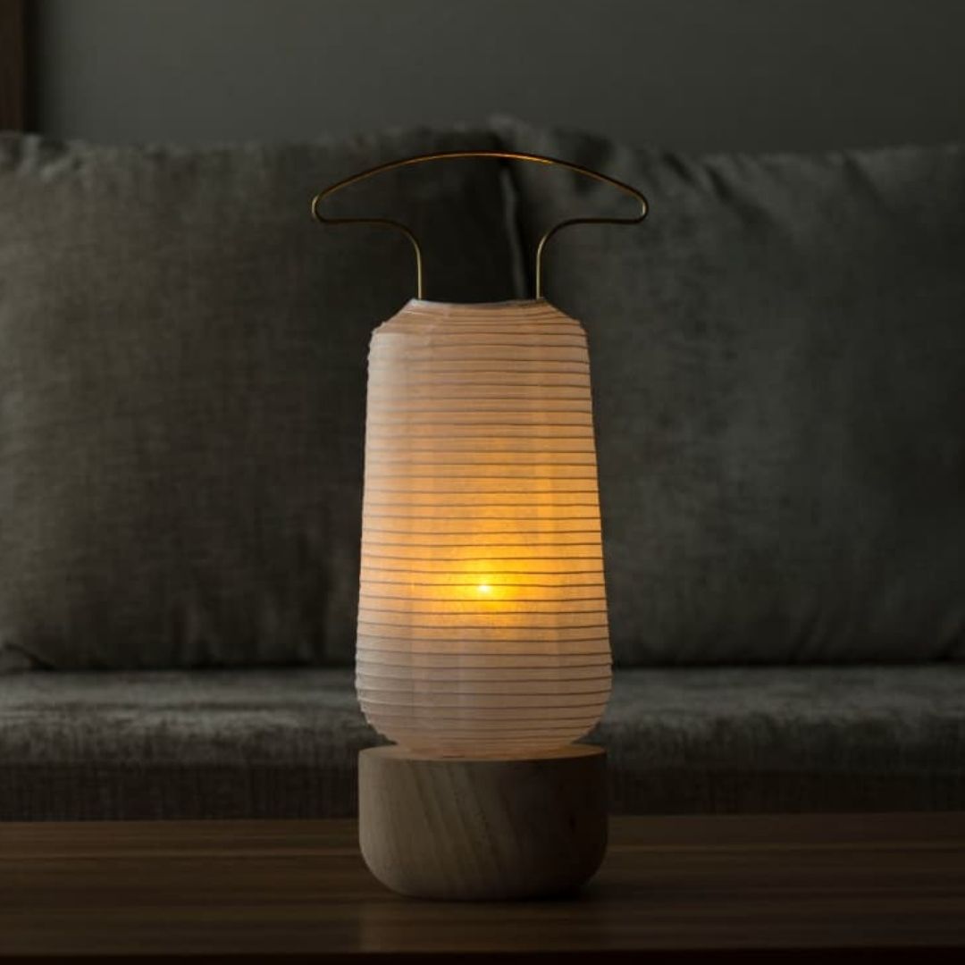 Japanese Paper Table Lamp "Akashi" on a wooden table