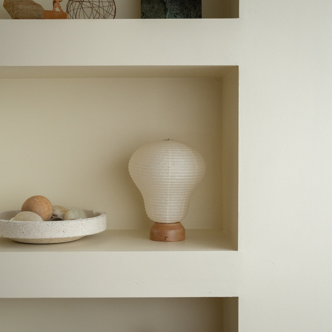 Japanese Paper Table Lamp "Balloon" on a white shelf in Japandi style room – Wabi-Sabi paper table lamps for bedroom