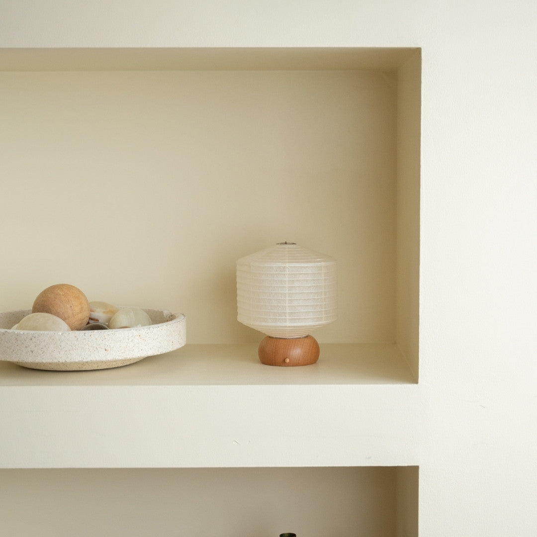 Japanese Paper Table Lamp "Mini Square" on a white shelf in Japandi style room – Unique portable night lamps for bedroom
