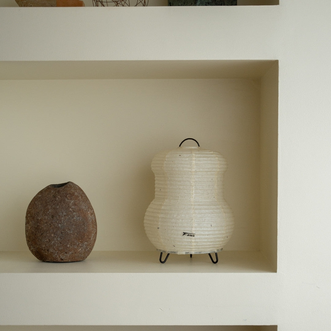 Japanese Paper Table Lamp "PAPERSON 03" on a white shelf in Japandi style room – Unique table lamp for living room