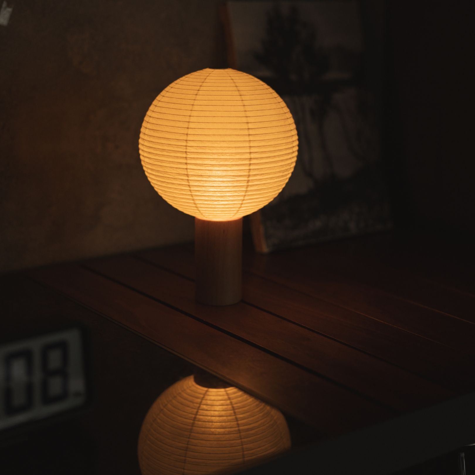 Japanese Paper Table Lamp "TORCHIN CIRCLE" Placed on a Living Room Console Table