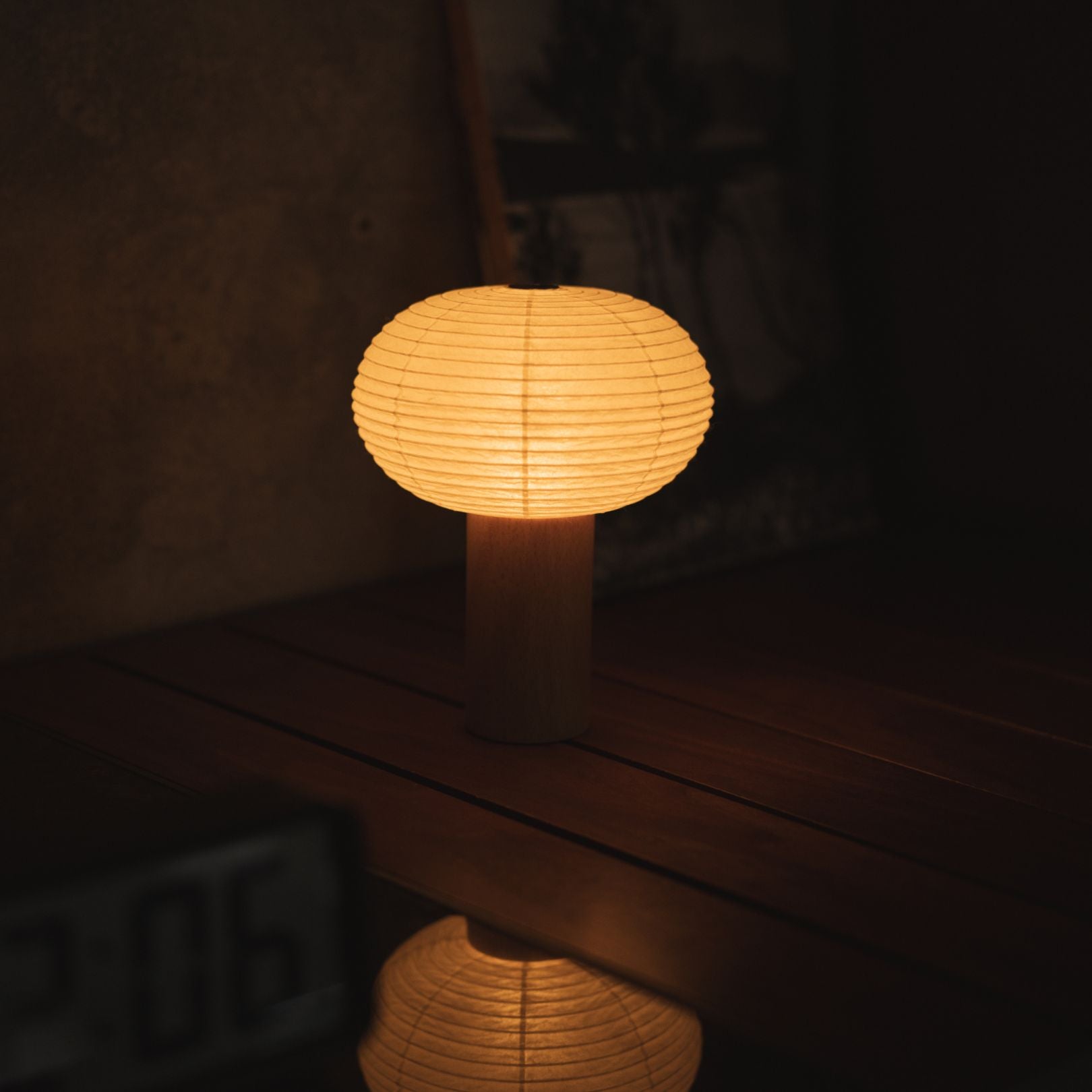 Japanese Paper Table Lamp "TORCHIN OVAL" Placed on a Living Room Console Table