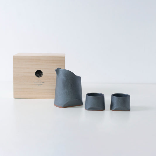 Gift set of iron-colored sake pitcher and two cups set, crafted using traditional Japanese roof tile techniques, presented in a paulownia wood box.
