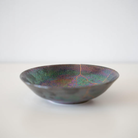 Bowl repaired with Kintsugi, a traditional Japanese technique that embraces the beauty of imperfection.