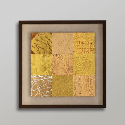 A gold leaf wall art composed of nine panels, each depicting a natural element like wind or rock.