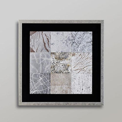 A silver leaf wall art composed of nine panels, each depicting a natural element like wind or rock.