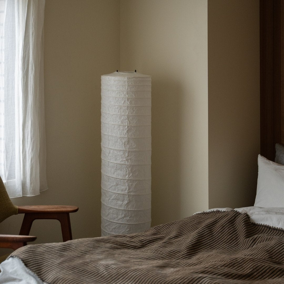 Japanese Washi Paper Floor Lamp "Momi Washi 02" in Japandi style bedroom – Wabi-Sabi tall standing lamp for bedroom