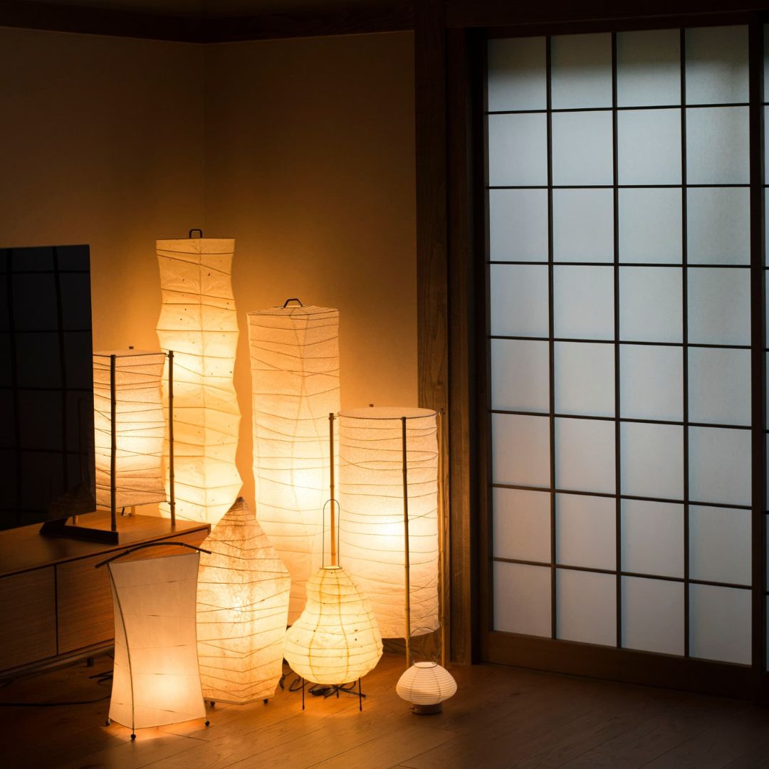 Japanese paper floor lamps in a corner of Japandi living room. 