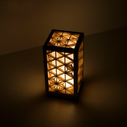 A table lamp using kumiko, a traditional Japanese technique of assembling small wooden pieces to create geometric patterns.