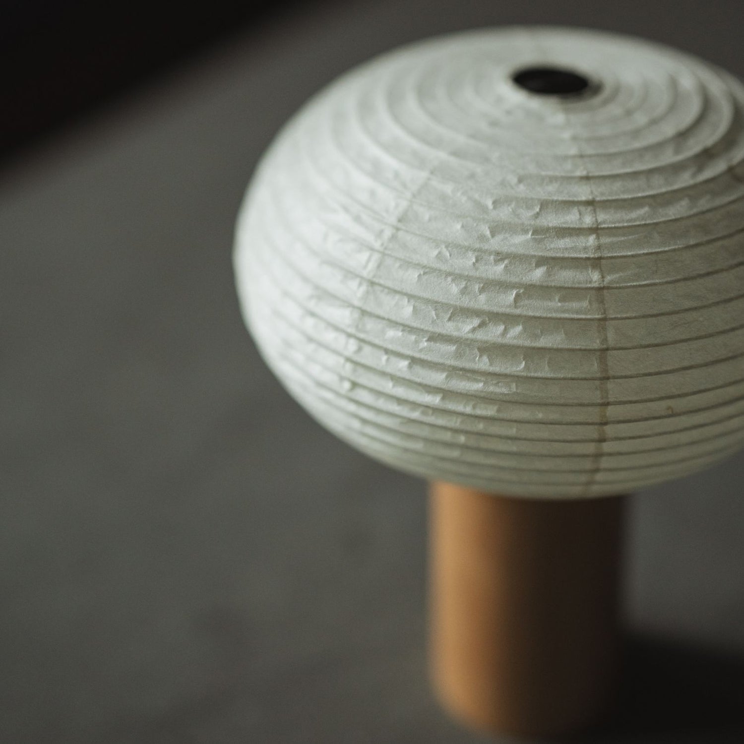 A Japanese "Yame lantern" on a grey table.