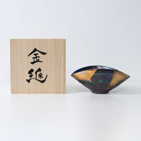 Handcrafted Kintsugi pottery bowl with gold repair, symbolizing wabi-sabi beauty