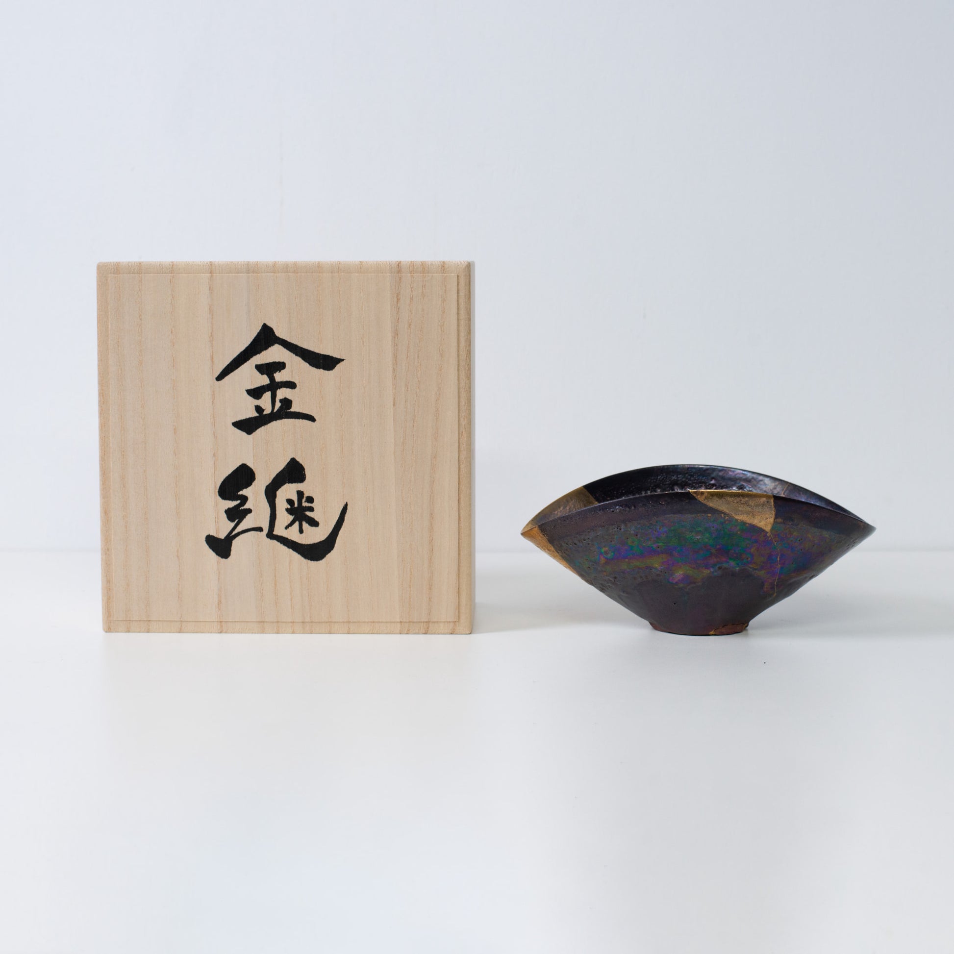Japanese Kintsugi bowl restored with pure gold, embodying resilience and imperfection