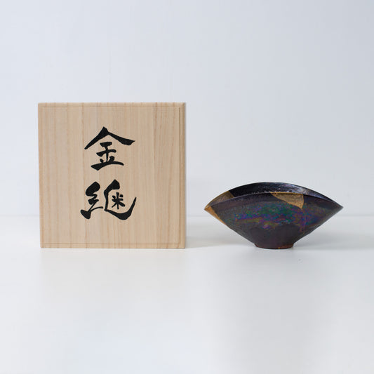 Japanese Kintsugi bowl restored with pure gold, embodying resilience and imperfection
