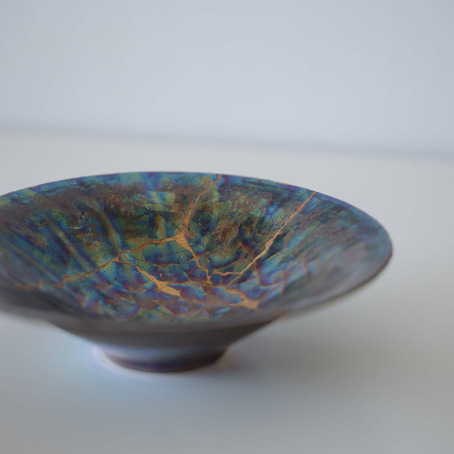 Close-up of Kintsugi Bowl "Blue Moon" side, highlighting the intricate Kintsugi repairs
