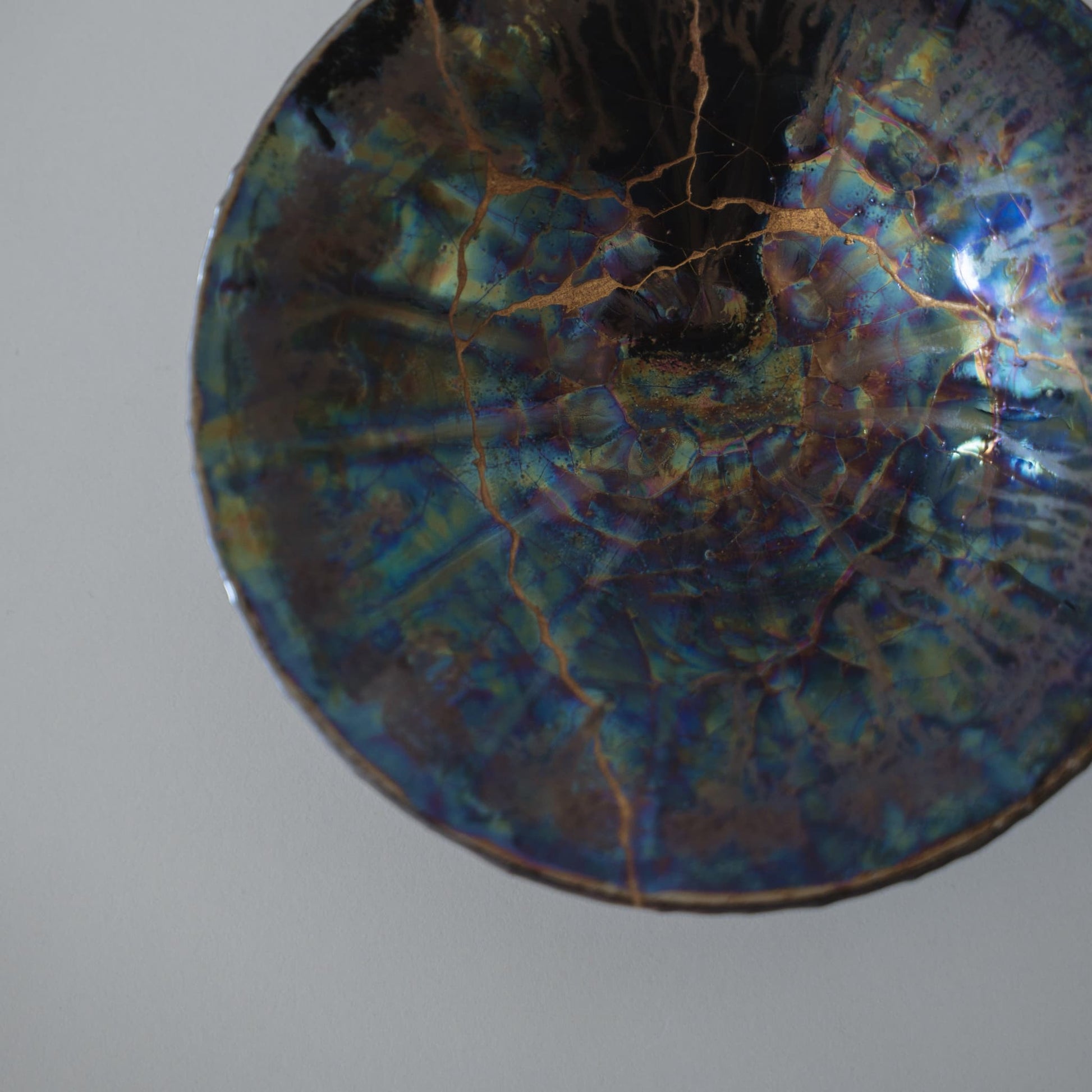 Overhead view of Kintsugi Bowl "Blue Moon" against a white background